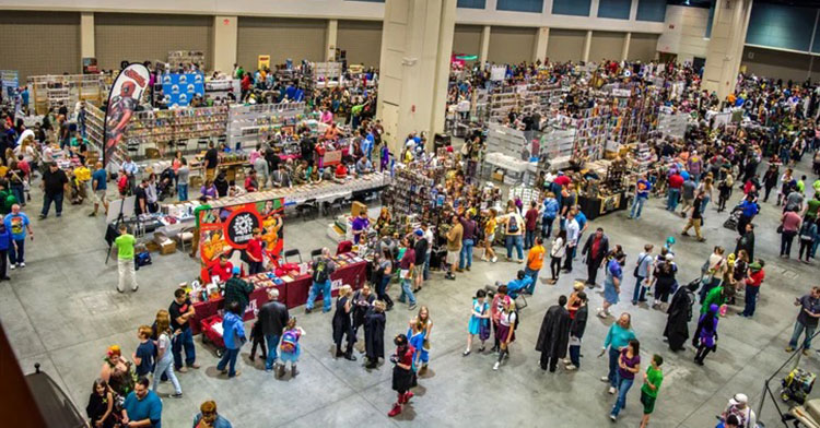 overhead photo of comicon main floor with people and vendors
